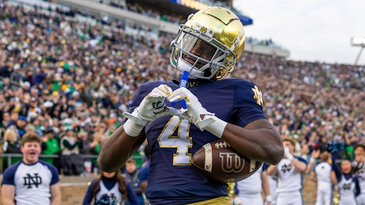 Nov 22, 2025; South Bend, Indiana, USA; Notre Dame Fighting Irish running back Jeremiyah Love (4) celebrates scoring against the Syracuse Orange during the first half at Notre Dame Stadium.