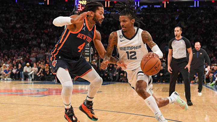 Nov 27, 2022; New York, New York, USA;  Memphis Grizzlies guard Ja Morant (12) drives to the basket on New York Knicks guard Derrick Rose (4) during the third quarter at Madison Square Garden. Mandatory Credit: Dennis Schneidler-Imagn Images