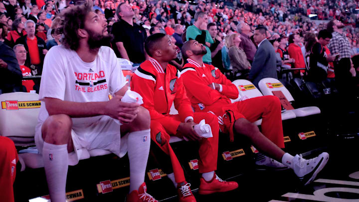 Mar 28, 2015; Portland, OR, USA;  Portland Trail Blazers center Robin Lopez (42), Portland Trail Blazers guard Damian Lillard (0) and Portland Trail Blazers forward Nicolas Batum (88) look at the scoreboard before being introduced and play the Denver Nuggets at Moda Center at the Rose Quarter. Mandatory Credit: Jaime Valdez-Imagn Images
