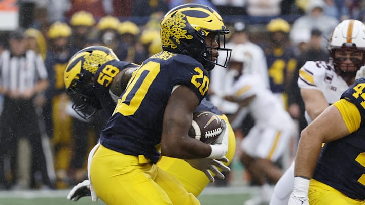 Sep 28, 2024; Ann Arbor, Michigan, USA;  Michigan Wolverines quarterback Alex Orji (10) rushes in the first half against the Minnesota Golden Gophers at Michigan Stadium. Mandatory Credit: Rick Osentoski-Imagn Images