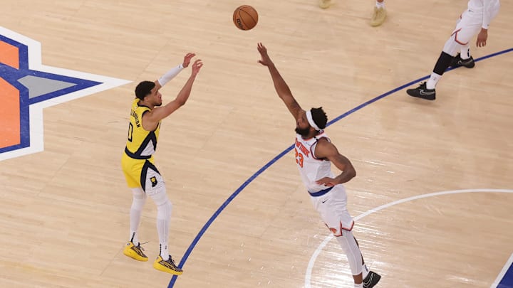 May 21, 2025; New York, New York, USA; Indiana Pacers guard Tyrese Haliburton (0) shoots a game-tying two point shot to send the game to overtime in the fourth quarter against New York Knicks center Mitchell Robinson (23) during game one of the eastern conference finals for the 2025 NBA Playoffs at Madison Square Garden. Mandatory Credit: Brad Penner-Imagn Images