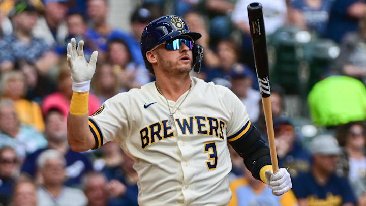 Milwaukee Brewers designated hitter Josh Donaldson reacts after striking out in his white uniform