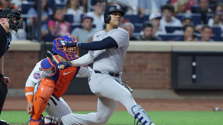 Jun 25, 2024; New York City, New York, USA; New York Yankees right fielder Juan Soto (22) follows through on a solo home run against the New York Mets during the fifth inning at Citi Field. Mandatory Credit: Brad Penner-USA TODAY Sports