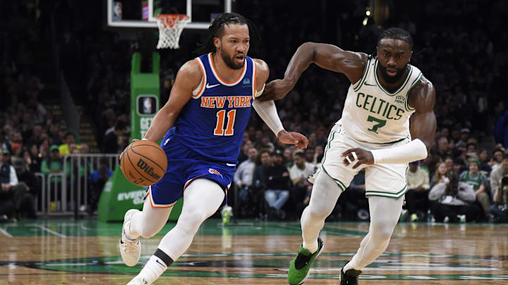 Apr 11, 2024; Boston, Massachusetts, USA;  New York Knicks guard Jalen Brunson (11) controls the ball while Boston Celtics guard Jaylen Brown (7) defends during the first half at TD Garden. Mandatory Credit: Bob DeChiara-Imagn Images