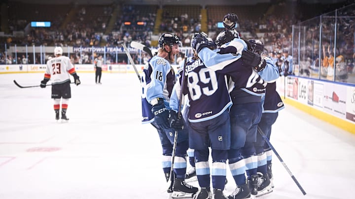 Milwaukee Admirals players celebrate a goal by center Fedor Svechkov (40) against the Coachella Valley Firebirds in the second period of Game 3 of their AHL playoff series Tuesday, June 4, 2024, at the UW-Milwaukee Panther Arena in Milwaukee, Wisconsin. The Firebirds won, 5-2, to take a 3-0 lead in the series.