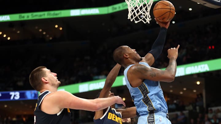 Oct 27, 2023; Memphis, Tennessee, USA; Memphis Grizzlies forward Xavier Tillman (2) shoots as Denver