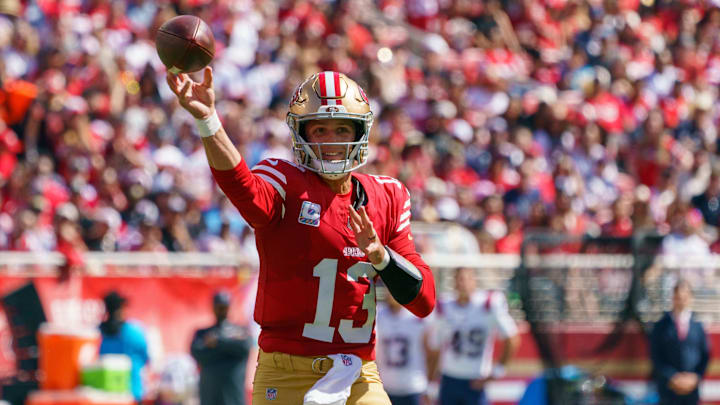 Sep 29, 2024; Santa Clara, California, USA; San Francisco 49ers quarterback Brock Purdy (13) passes the football against the New England Patriots during the first quarter at Levi's Stadium. Mandatory Credit: Neville E. Guard-Imagn Images