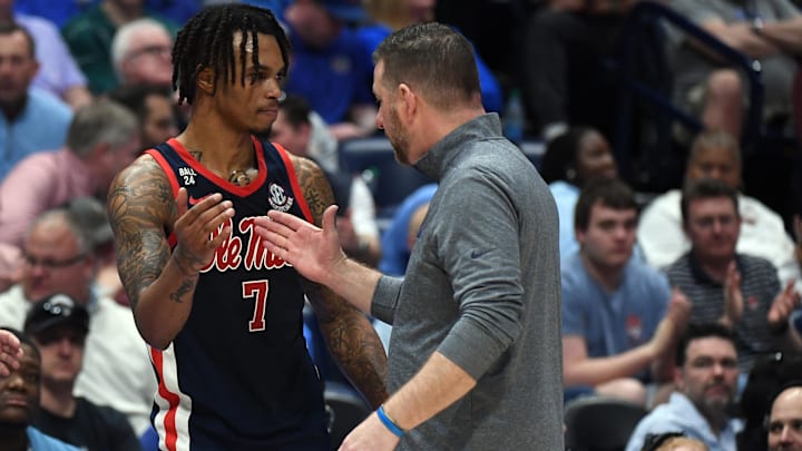 Mar 14, 2024; Nashville, TN, USA; Mississippi Rebels guard Allen Flanigan (7) and head coach Chris Beard after fouling out during the second half against the Texas A&M Aggies at Bridgestone Arena. Mandatory Credit: Christopher Hanewinckel-Imagn Images Mar 14, 2024; Nashville, TN, USA; Mississippi Rebels guard Allen Flanigan (7) and head coach Chris Beard after fouling out during the second half against the Texas A&M Aggies at Bridgestone Arena. Mandatory Credit: Christopher Hanewinckel-Imagn Images
