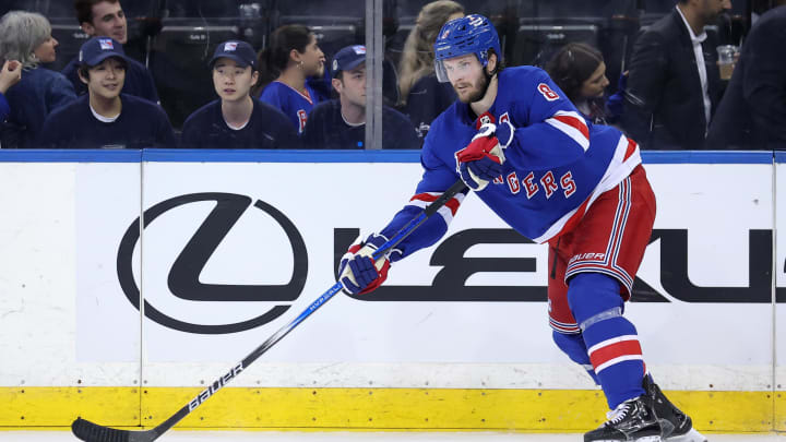 May 22, 2024; New York, New York, USA; New York Rangers defenseman Jacob Trouba (8) controls the puck against the Florida Panthers during the third period of game one of the Eastern Conference Final of the 2024 Stanley Cup Playoffs at Madison Square Garden. Mandatory Credit: Brad Penner-USA TODAY Sports