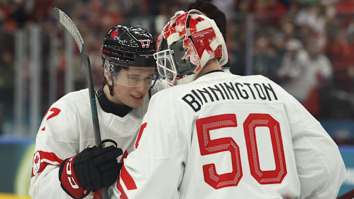 Feb 12, 2026; Milan, Italy; Macklin Celebrini and Jordan Binnington of Canada celebrate after the match against Czechia in a men's ice hockey group A match during the Milano Cortina 2026 Olympic Winter Games at Milano Santagiulia Ice Hockey Arena. Mandatory Credit: Geoff Burke-Imagn Images Feb 12, 2026; Milan, Italy; Macklin Celebrini and Jordan Binnington of Canada celebrate after the match against Czechia in a men's ice hockey group A match during the Milano Cortina 2026 Olympic Winter Games at Milano Santagiulia Ice Hockey Arena. Mandatory Credit: Geoff Burke-Imagn Images
