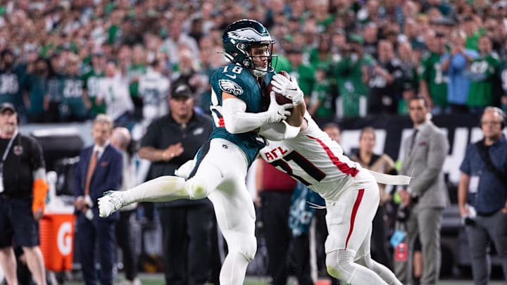 Sep 16, 2024; Philadelphia, Pennsylvania, USA; Philadelphia Eagles wide receiver Britain Covey (18) makes a catch against Atlanta Falcons safety Justin Simmons (31) during the second quarter at Lincoln Financial Field. Mandatory Credit: Bill Streicher-Imagn Images