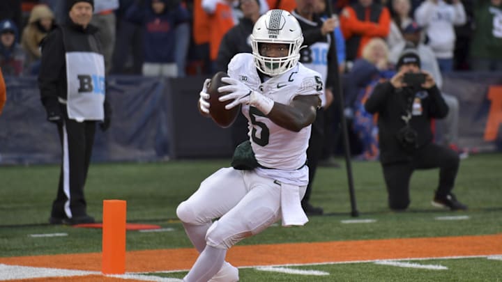 Nov 16, 2024; Champaign, Illinois, USA; Michigan State Spartans running back Nate Carter (5) scores a touchdown during the second half against the Illinois Fighting Illini at Memorial Stadium. Mandatory Credit: Ron Johnson-Imagn Images