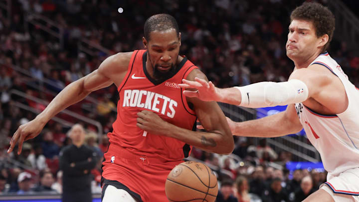Feb 11, 2026; Houston, Texas, USA; Los Angeles Clippers center Brook Lopez (11) tries to steal the ball from Houston Rockets forward Kevin Durant (7) in the second half at Toyota Center. Mandatory Credit: Thomas Shea-Imagn Images