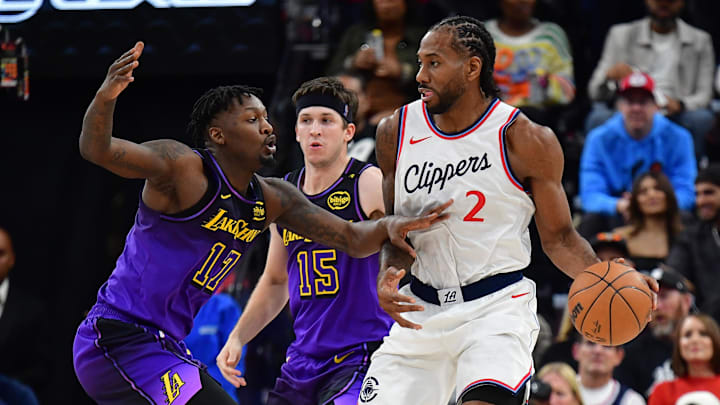 Jan 19, 2025; Inglewood, California, USA; Los Angeles Clippers forward Kawhi Leonard (2) moves the ball against Los Angeles Lakers forward Dorian Finney-Smith (17) during the second half at Intuit Dome. Mandatory Credit: Gary A. Vasquez-Imagn Images