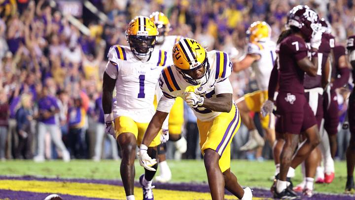 LSU Tigers running back Harlem Berry (22) celebrates with wide receiver Aaron Anderson (1) after a touchdown during the first half against the Texas A&M Aggies at Tiger Stadium. LSU Tigers running back Harlem Berry (22) celebrates with wide receiver Aaron Anderson (1) after a touchdown during the first half against the Texas A&M Aggies at Tiger Stadium.