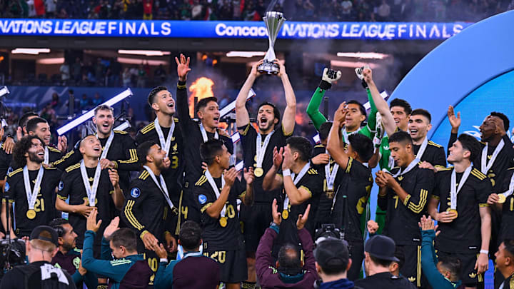 The Mexico national team celebrate their first ever Concacaf Nations League trophy.
