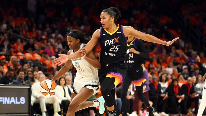 Oct 8, 2025; Phoenix, Arizona, USA; Las Vegas Aces guard Jackie Young (0) controls the ball against Phoenix Mercury forward Alyssa Thomas (25) in the first half during game three of the 2025 WNBA Finals at PHX Arena. Mandatory Credit: Mark J. Rebilas-Imagn Images