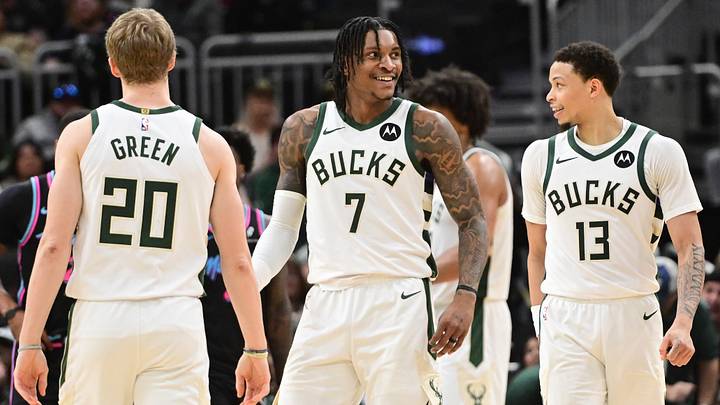 Feb 24, 2026; Milwaukee, Wisconsin, USA;  Milwaukee Bucks guard Kevin Porter (7) reacts with guard AJ Green (20) and guard Ryan Rollins (13) after scoring a basket late in the fourth quarter against the Miami Heat at Fiserv Forum. Mandatory Credit: Benny Sieu-Imagn Images