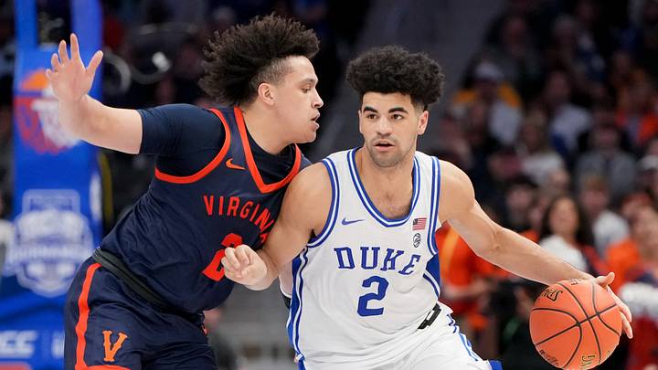 Mar 14, 2026; Charlotte, NC, USA; Duke Blue Devils guard Cayden Boozer (2) dribbles against Virginia Cavaliers guard Chance Mallory (2) during the men's ACC Conference Tournament Championship at Spectrum Center. Mandatory Credit: Bob Donnan-Imagn Images Mar 14, 2026; Charlotte, NC, USA; Duke Blue Devils guard Cayden Boozer (2) dribbles against Virginia Cavaliers guard Chance Mallory (2) during the men's ACC Conference Tournament Championship at Spectrum Center. Mandatory Credit: Bob Donnan-Imagn Images