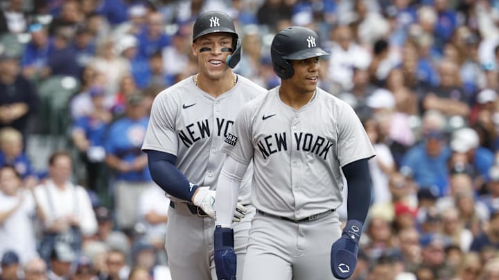 Sep 6, 2024; Chicago, Illinois, USA; New York Yankees outfielder Aaron Judge (99) and New York Yankees outfielder Juan Soto (22) celebrate after scoring agianst the Chicago Cubs during the third inning at Wrigley Field. Mandatory Credit: Kamil Krzaczynski-Imagn Images