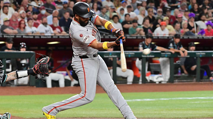 Sep 23, 2024; Phoenix, Arizona, USA;  San Francisco Giants outfielder Jerar Encarnacion (59) hits a RBI double in the third inning against the Arizona Diamondbacks at Chase Field.