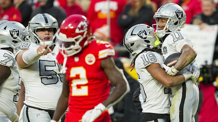 Nov 29, 2024; Kansas City, Missouri, USA; Las Vegas Raiders wide receiver Tre Tucker (11) celebrates with wide receiver Jakobi Meyers (16) after scoring a touchdown during the second half against the Kansas City Chiefs at GEHA Field at Arrowhead Stadium. Mandatory Credit: Jay Biggerstaff-Imagn Images