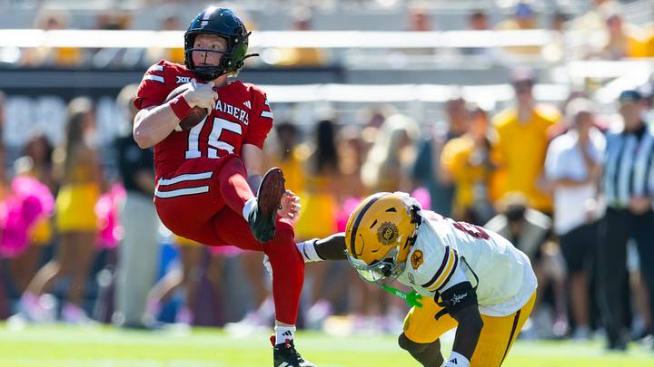 Oct 18, 2025; Tempe, Arizona, USA; Texas Tech Red Raiders quarterback Will Hammond (15) is upended by Arizona State Sun Devils safety Adrian Wilson (6) in the first half at Mountain America Stadium. Mandatory Credit: Mark J. Rebilas-Imagn Images Oct 18, 2025; Tempe, Arizona, USA; Texas Tech Red Raiders quarterback Will Hammond (15) is upended by Arizona State Sun Devils safety Adrian Wilson (6) in the first half at Mountain America Stadium. Mandatory Credit: Mark J. Rebilas-Imagn Images