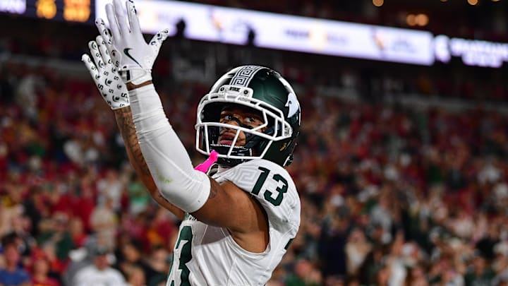 Sep 20, 2025; Los Angeles, California, USA; Michigan State Spartans wide receiver Chrishon McCray (13) celebrates his touchdown scored against the Southern California Trojans during the first half at the Los Angeles Memorial Coliseum. Mandatory Credit: Gary A. Vasquez-Imagn Images