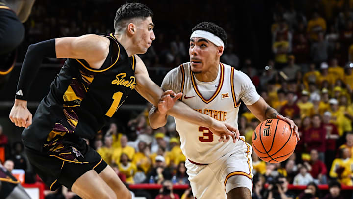 Mar 7, 2026; Ames, Iowa, USA; Iowa State Cyclones guard Tamin Lipsey (3) goes to the basket as Arizona State Sun Devils forward Andrija Grbovic (14) defends during the first half at James H. Hilton Coliseum.