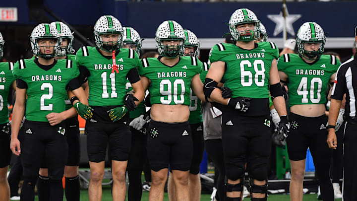 Southlake Carroll's captains walk to mid-field during the 6A DII UIL Texas State Football Championship game against Austin Vandegrift on Saturday, December 21, 2024 at AT&T Stadium in Arlington.