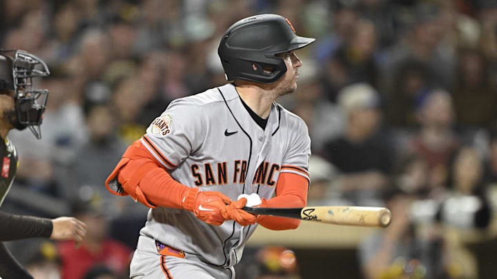 Mar 30, 2026; San Diego, California, USA; San Francisco Giants catcher Patrick Bailey (14) hits an RBI single during the third inning against the San Diego Padres at Petco Park. Mandatory Credit: Denis Poroy-Imagn Images