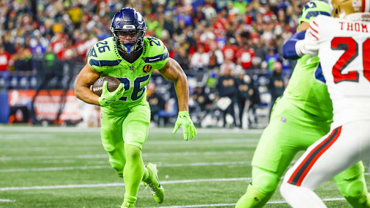 Nov 23, 2023; Seattle, Washington, USA; Seattle Seahawks running back Zach Charbonnet (26) rushes
