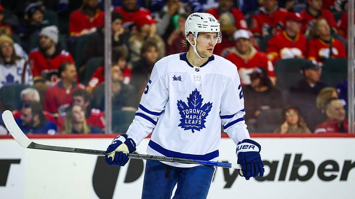 Feb 2, 2026; Calgary, Alberta, CAN; Toronto Maple Leafs defenseman Brandon Carlo (25) against the Calgary Flames during the second period at Scotiabank Saddledome. Mandatory Credit: Sergei Belski-Imagn Images