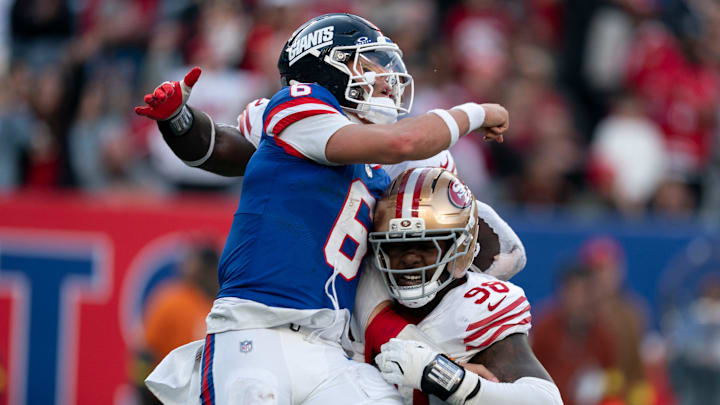 New York Giants quarterback Jaxson Dart takes a hit from the 49ers in last week's game.