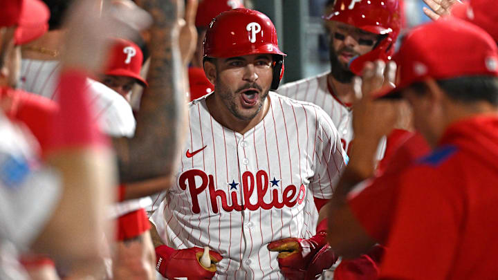 Sep 23, 2025; Philadelphia, Pennsylvania, USA; Philadelphia Phillies first base Otto Kemp (4) celebrates his two-run home run in the dugout during the second inning against the Miami Marlins at Citizens Bank Park. Mandatory Credit: Eric Hartline-Imagn Images