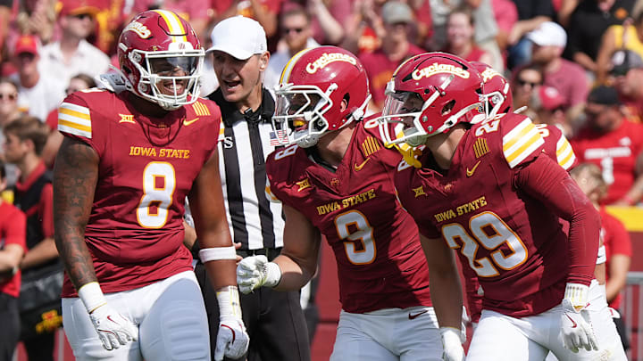 Iowa State Cyclones' defensive line Vontroy Malone (8), linebacker Cael Brezina (9), and defensive back Drew Surges (29) celebrate after a stop of South Dakota during the second quarter in the home game opening at Jack Trice Stadium on August 30, 2025, in Ames, Iowa