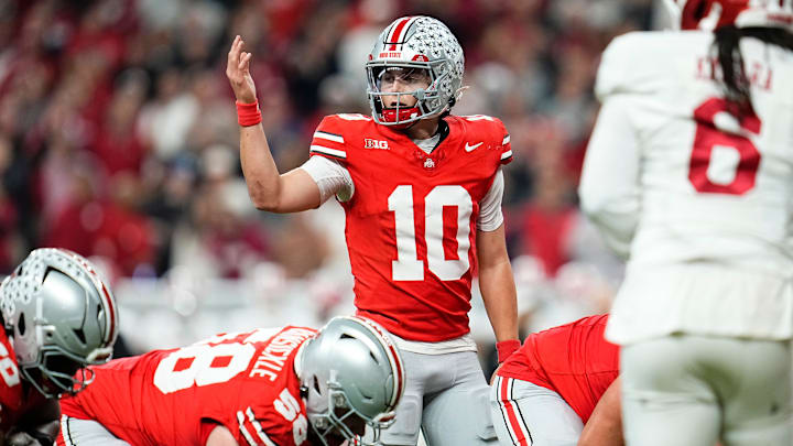 Ohio State Buckeyes quarterback Julian Sayin (10) motions during the Big Ten Conference championship game against the Indiana Hoosiers at Lucas Oil Stadium in Indianapolis on Dec. 6, 2025. Ohio State lost 13-10.