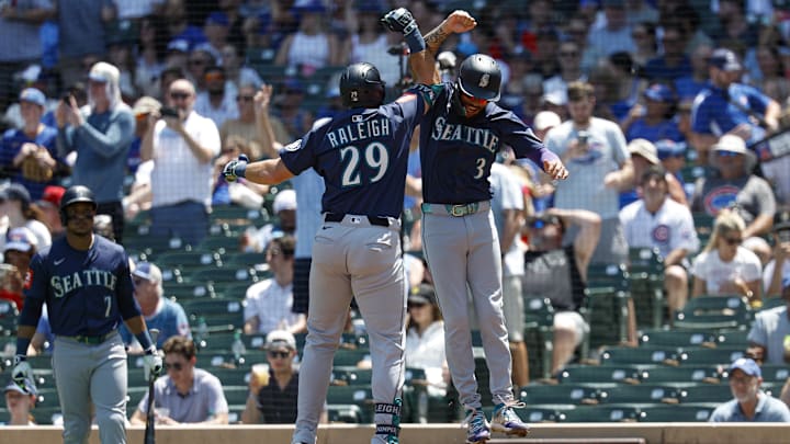 Seattle Mariners designated hitter Cal Raleigh (left) celebrates with shortstop J.P. Crawford (3) after the former hit a home run against the Chicago Cubs on June 22 at Wrigley Field. Seattle Mariners designated hitter Cal Raleigh (left) celebrates with shortstop J.P. Crawford (3) after the former hit a home run against the Chicago Cubs on June 22 at Wrigley Field.
