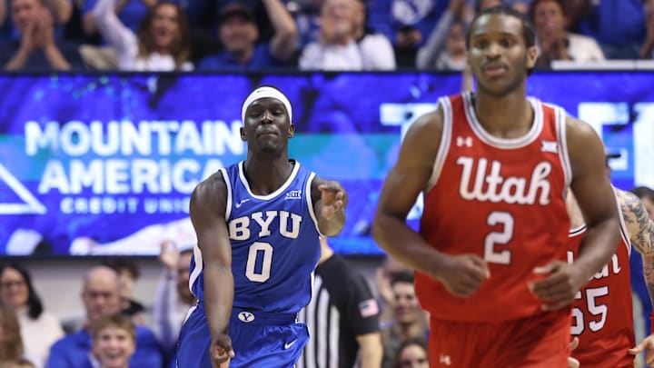 Mar 8, 2025; Provo, Utah, USA; Brigham Young Cougars forward Mawot Mag (0) reacts to a three point shot against the Utah Utes during the second half at Marriott Center. Mandatory Credit: Rob Gray-Imagn Images Mar 8, 2025; Provo, Utah, USA; Brigham Young Cougars forward Mawot Mag (0) reacts to a three point shot against the Utah Utes during the second half at Marriott Center. Mandatory Credit: Rob Gray-Imagn Images