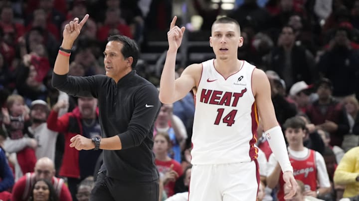 Apr 16, 2025; Chicago, Illinois, USA; Miami Heat guard Tyler Herro (14) and head coach Erik Spoelstra ask for a replay against the Chicago Bulls during the second half at United Center. Mandatory Credit: David Banks-Imagn Images