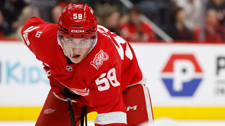 Jan 8, 2026; Detroit, Michigan, USA;  Detroit Red Wings center Emmitt Finnie (58) gets set during a face off in the second period against the Vancouver Canucks at Little Caesars Arena. Mandatory Credit: Rick Osentoski-Imagn Images
