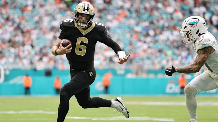 New Orleans Saints QB Tyler Shough (6) is chased down by Miami Dolphins S Ashtyn Davis (21) on Nov.  30., 2025.
