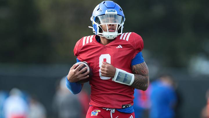Kansas redshirt sophomore quarterback Isaiah Marshall (8) works on drills during practice at the University of Kansas on Thursday, April 9, 2026. Kansas redshirt sophomore quarterback Isaiah Marshall (8) works on drills during practice at the University of Kansas on Thursday, April 9, 2026.