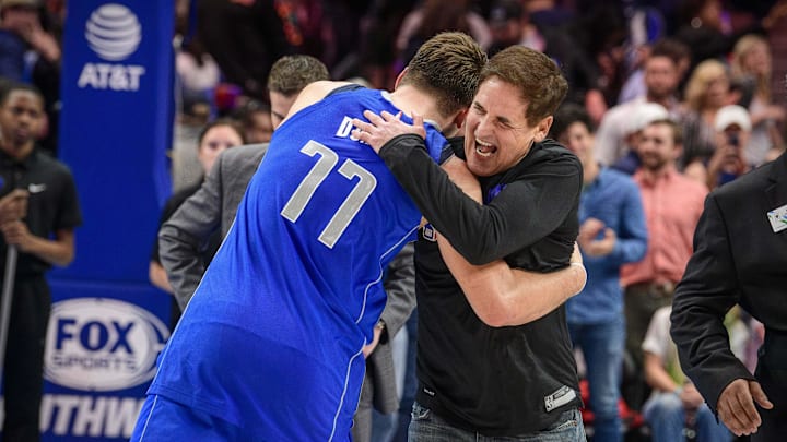 Dallas Mavericks owner Mark Cuban hugs forward Luka Doncic (77) after the win over the San Antonio Spurs at the American Airlines Center.