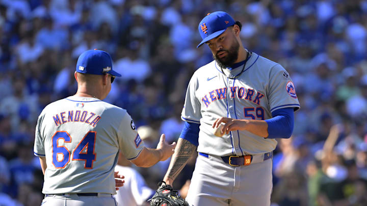 Oct 14, 2024; Los Angeles, California, USA; New York Mets manager Carlos Mendoza (64) relieves pitcher Sean Manaea (59) in the sixth inning against the Los Angeles Dodgers during game two of the NLCS for the 2024 MLB Playoffs at Dodger Stadium. Mandatory Credit: Jayne Kamin-Oncea-Imagn Images Oct 14, 2024; Los Angeles, California, USA; New York Mets manager Carlos Mendoza (64) relieves pitcher Sean Manaea (59) in the sixth inning against the Los Angeles Dodgers during game two of the NLCS for the 2024 MLB Playoffs at Dodger Stadium. Mandatory Credit: Jayne Kamin-Oncea-Imagn Images