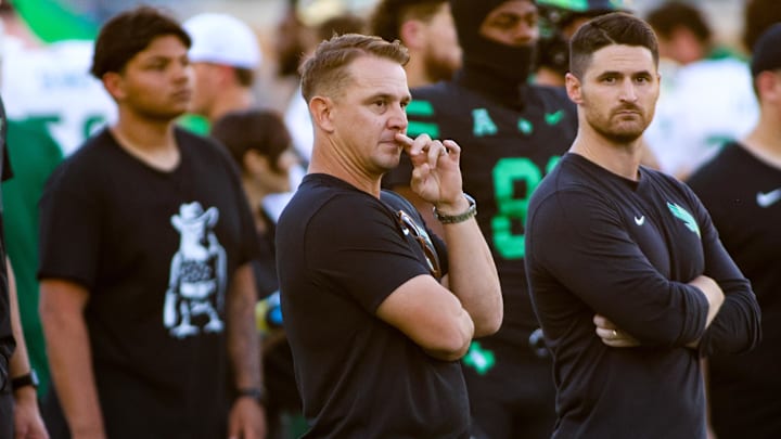 Oct 10, 2025; Denton, Texas, USA; North Texas Mean Green head coach Eric Morris watches his team warm up prior to a game against the South Florida Bulls at DATCU Stadium. Mandatory Credit: Raymond Carlin III-Imagn Images