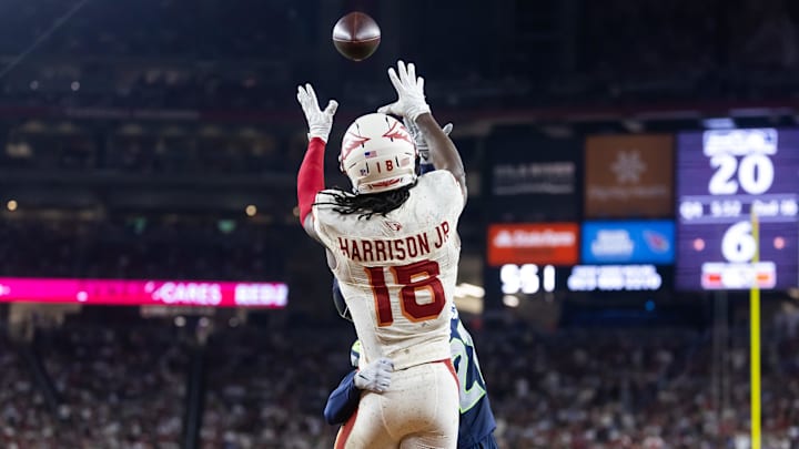 Sep 25, 2025; Glendale, Arizona, USA; Arizona Cardinals wide receiver Marvin Harrison Jr. (18) catches a pass for a touchdown against the Seattle Seahawks at State Farm Stadium. 