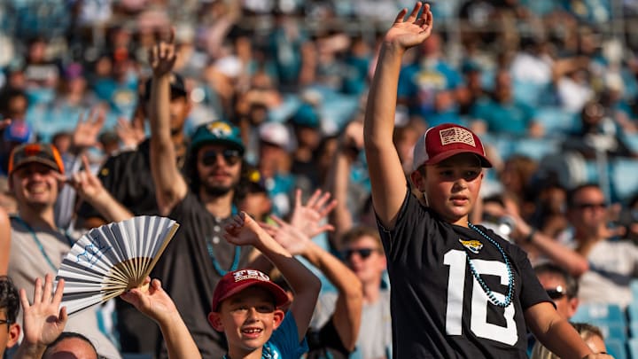 Jaguar fans wave to their favorite player before an NFL scrimmage at EverBank Stadium Friday August 1, 2025, in Jacksonville, Fla. [Doug Engle/Florida Times-Union]