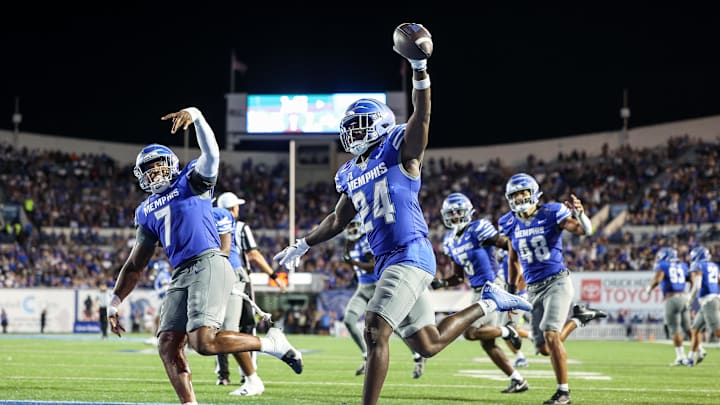Oct 4, 2025; Memphis, Tennessee, USA; Memphis Tigers defensive back Kamari Wilson (24) celebrates after an interception against the Tulsa Golden Hurricane during the first half at Simmons Bank Liberty Stadium. Mandatory Credit: Wesley Hale-Imagn Images