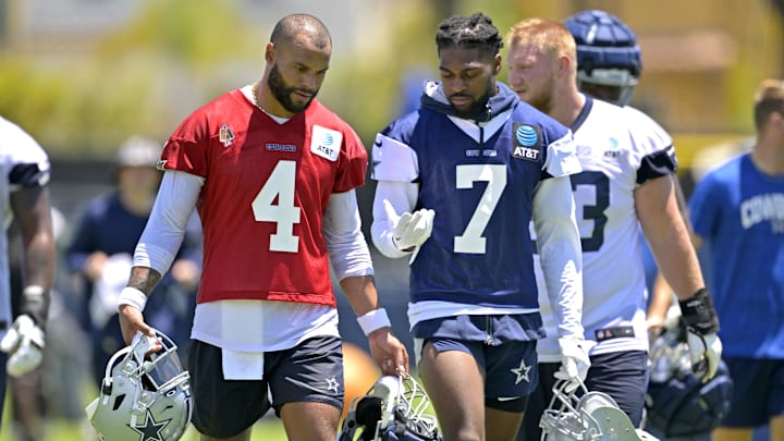 Dallas Cowboys quarterback Dak Prescott talks with cornerback Trevon Diggs during training camp at River Ridge Playing Fields